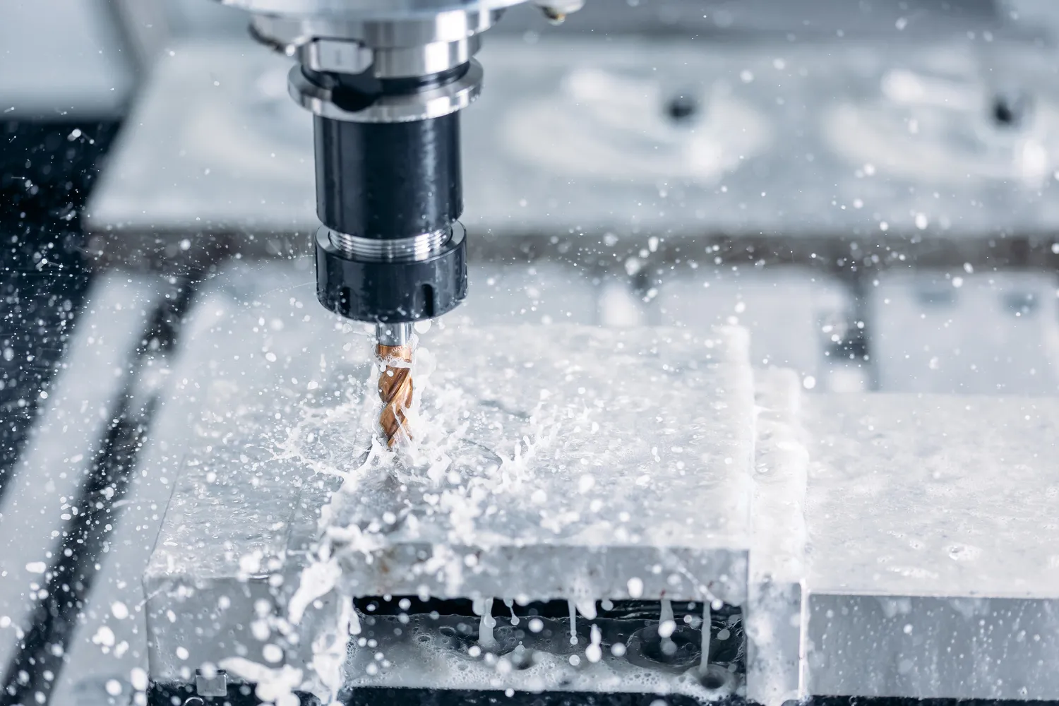 close up to CNC machine during CNC milling of special designed automotive parts